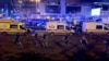 در تصویر نیروهای مسلح و امولانس ها دیده میشوند که در محل رویداد جمعه شب در مسکو حضور یافته اند.