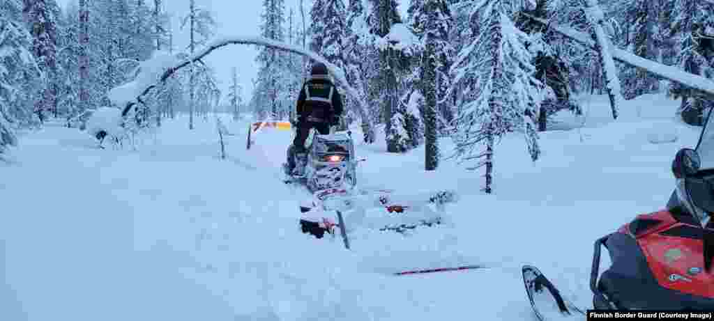 Border guards patrol on snowmobiles in the Kuusamo region, alongside Russia, in February 2023. Much of Finland&rsquo;s 1,340 kilometer border with Russia is seen as too remote and inaccessible to require any physical barriers. The 200 kilometers of new fencing will instead be placed in areas easily reached by road, mostly in the southeast of the country, but also in the northern Lapland region. &nbsp;