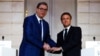 French President Emmanuel Macron (right) and Serbian President Aleksandar Vucic before a working dinner at the Elysee Palace in Paris on April 8