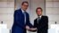 French President Emmanuel Macron (right) and Serbian President Aleksandar Vucic before a working dinner at the Elysee Palace in Paris on April 8