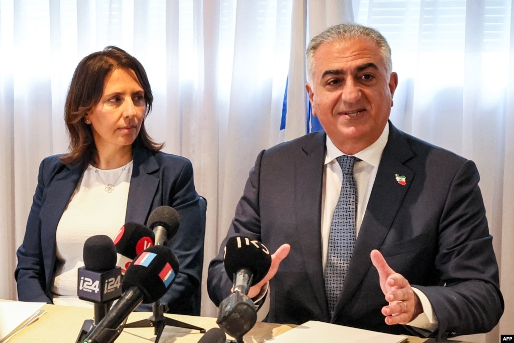 Reza Pahlavi (right) and Israeli Intelligence Minister Gila Gamliel speak with reporters during a meeting at a hotel in Tel Aviv on April 19.