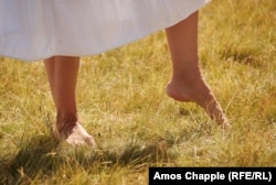 A woman during the paneurhythmy, which is performed barefoot.