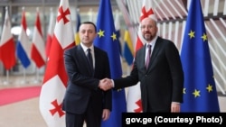 Georgian Prime Minister Irakli Gharibashvili (left) meets with European Council President Charles Michel in Brussels on April 25.