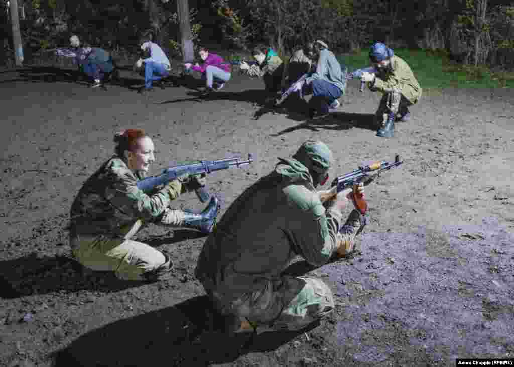 A woman is instructed on how to aim her dummy weapon. The most recent mass sign-up to VOMA came after Baku&rsquo;s September 19 military offensive, which ended with the complete recapture of Nagorno-Karabakh by Azerbaijan, ending a centuries-old presence of ethnic Armenians in the region.