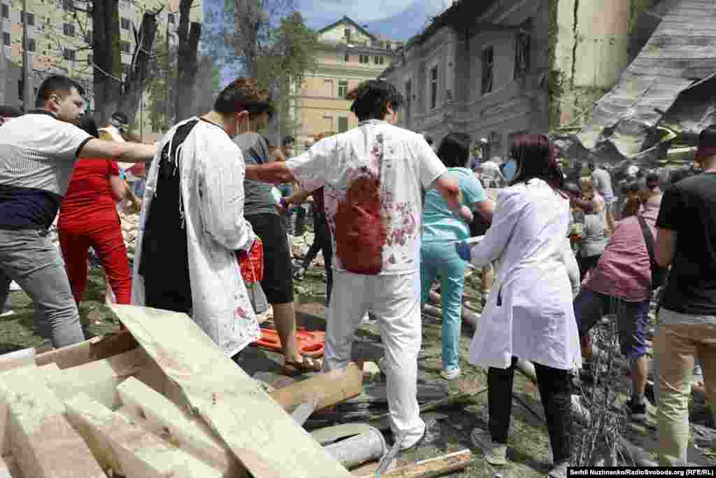 People remove rubble as they search for survivors at the children&#39;s hospital. Kyiv Mayor Vitaliy Klitschko told Reuters that the attack was &quot;one of the worst&quot; on the city in the 28-month-old full-scale war.