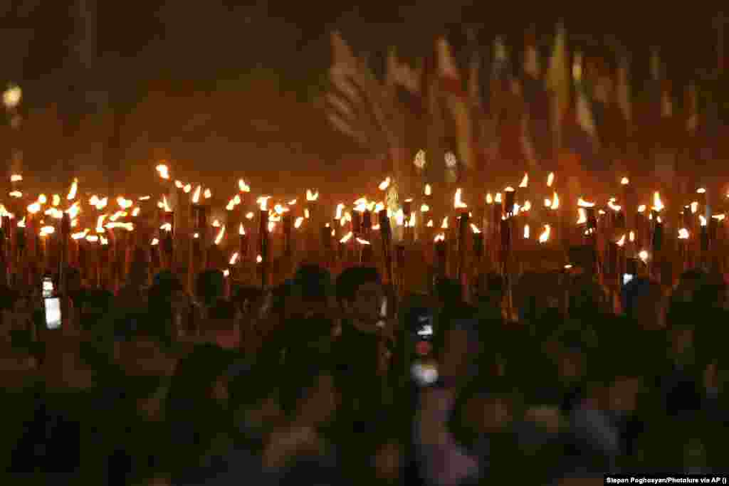 Thousands of Armenians participate in a torchlit procession in the nation&#39;s capital, Yerevan, on April 23. &nbsp;