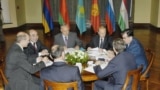 This June 2004 photo is one of first images in existence of a meeting of the heads of the Collective Security Treaty Organization&nbsp;(CSTO) military alliance.<br />
<br />
The image shows Presidents (left to right) Alyaksandr Lukashenka of Belarus, Askar Akaev of Kyrgyzstan, Nursultan Nazarbaev of Kazakhstan, Vladimir Putin of Russia, Emomali Rahmon&nbsp;of Tajikistan, and Secretary-General Nikolai Bordyuzha (with back to camera on right) and President Robert Kocharian of Armenia (back to camera in foreground) during a meeting of the CSTO in Astana, Kazakhstan.<br />
<br />
<br />
&nbsp;