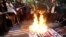 Iranians burn Israeli and U.S. flags during a protest at Palestine Square in Tehran on April 1.