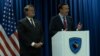 U.S. Senators Gary Peters (left) and Chris Murphy address a press conference in Pristina, Kosovo's capital on May 22.