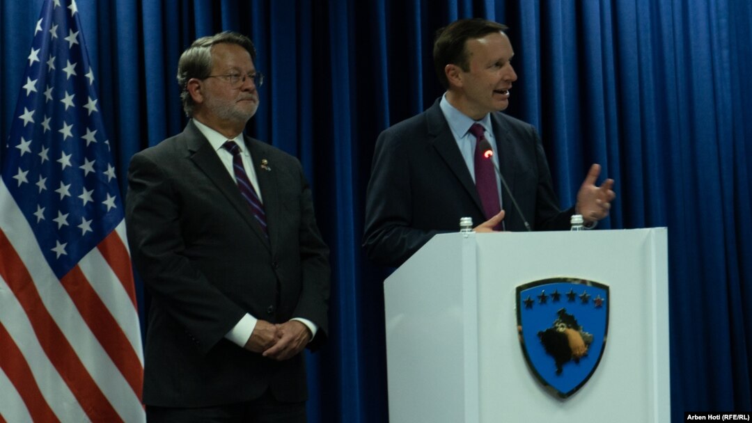 U.S. Senators Gary Peters (left) and Chris Murphy address a press conference in Pristina, Kosovo's capital on May 22.