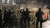 Police use tear gas to disperse protesters during a rally against a draft law on "foreign agents," which critics say represents an authoritarian shift and could hurt Georgia's bid to join the European Union, in Tbilisi on March 9.
