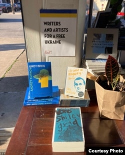 A display of Ukrainian-authored books published by Deep Vellum, outside the Town Hall performance space in New York City after the PEN America Literary Awards on February 28. The books on show are by Andrey Kurkov, Serhiy Zhadan, and filmmaker Oleh Sentsov, a former captive of Russia.
