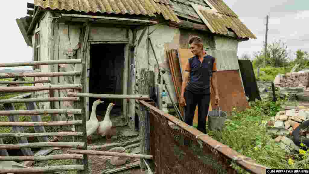 Mykola checks on the two geese that previously belonged to his brother&#39;s family. With no work, he spend his time scrounging for materials to repair his home. &ldquo;I need building materials and tools, but I don&rsquo;t want to collect them from someone&rsquo;s destroyed home,&rdquo; he says.&nbsp;&nbsp;