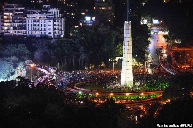 Peaceful protesters surround the monument on Heroes&#39; Square. The May 1 demonstration -- one of the largest the country has ever seen -- took place after the bill advanced in a second-reading vote.&nbsp;