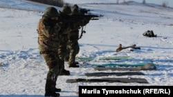 Belarusian recruits for the Kastus Kalinouski Regiment practice shooting on February 8. What unites them is the hope that by helping Ukraine defend itself against Russia they may speed up the downfall of Lukashenka.