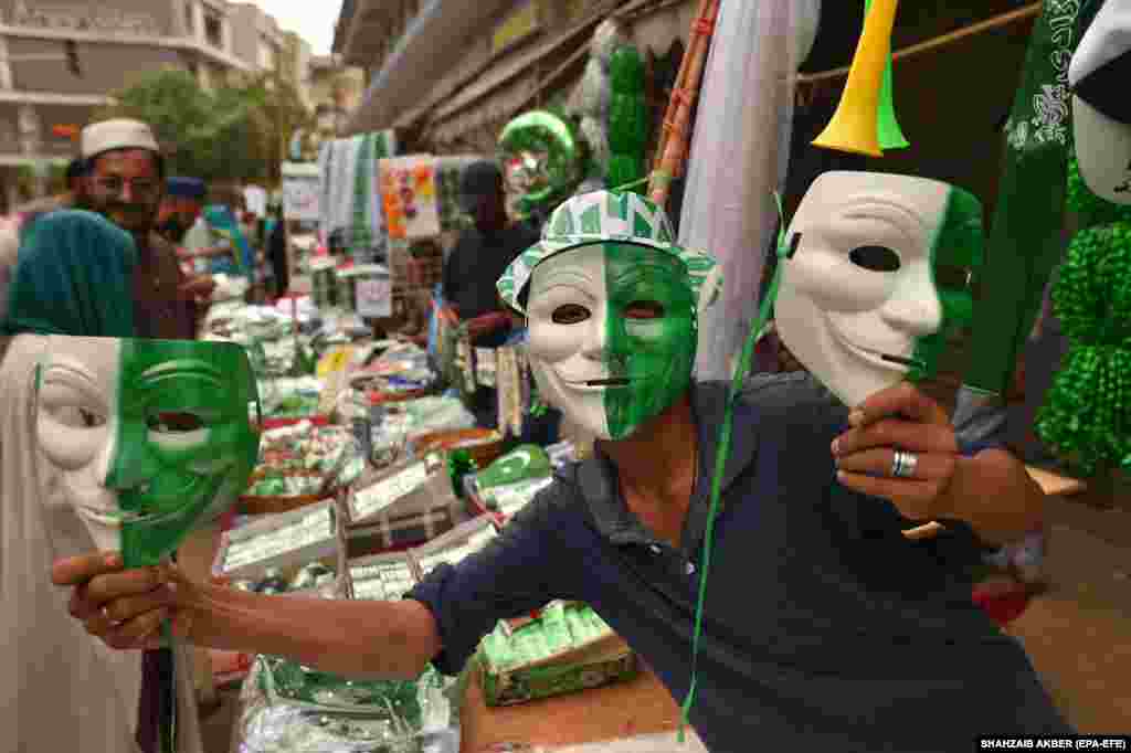 A vendor sells Guy Fawkes masks. Pakistan&#39;s cash-strapped economy is currently experiencing 0.29 percent growth in gross domestic product with inflation over 28 percent, down from a record high of 38 percent in previous months.
