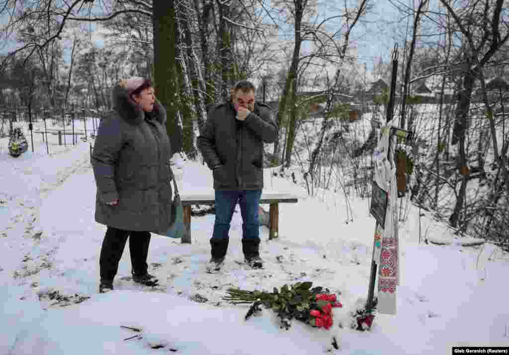 On a cold February day, Safonova was joined by Shchyruk as they visited Filkina&#39;s grave in Bucha. They struggled to hold back their tears after placing 12 pink roses near the simple cross that marks her final resting place.