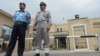 Pakistani policemen stand in front of the Election Commission of Pakistan (ECP) office in Islamabad. 