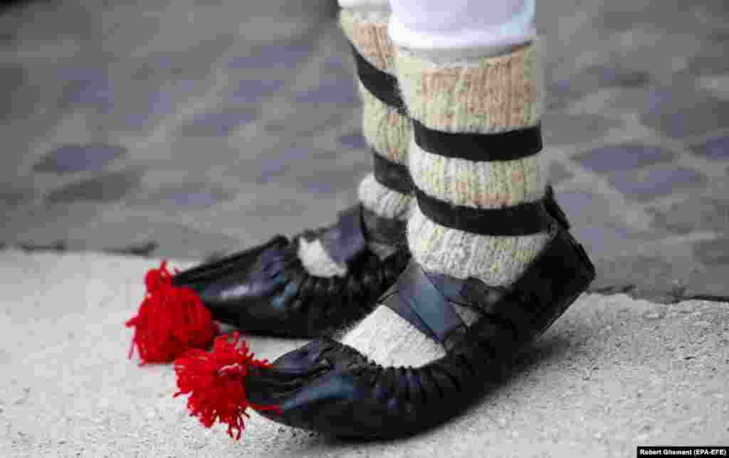 Pom-poms on a festival participant&#39;s shoes.&nbsp;