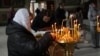 People pray in Khmelnytskiy Cathedral on Easter Sunday. 