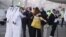 سیامک نمازی و مراد طاهباز، دو آمریکایی آزاد شده از ایران، پس از ورود به فرودگاه دوحه