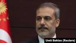 Turkey - New Foreign Minister Hakan Fidan stands during a press conference where Turkish President Tayyip Erdogan announced the new cabinet, Ankara, June 3, 2023.