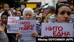 Women hold signs reading "Not a single one more" during a demonstration against domestic violence in Sofia on July 31. 