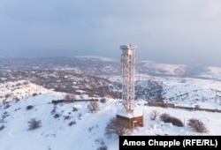 The Orgov telescope complex includes a gold-plated parabolic antenna that can be raised up to the top of this tower with a specialized elevator.