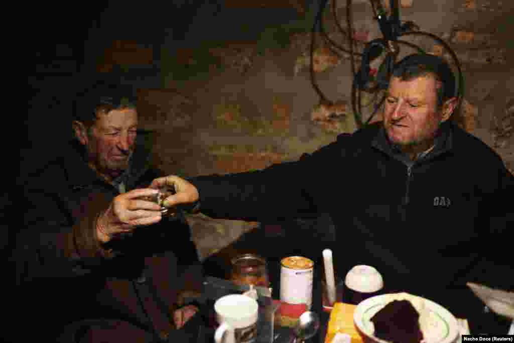 Despite the shattered landscape, the Kovalyov brothers, Stepan (left) and his 77-year-old brother, Volodymyr, have vowed to live out their final days with their wives on their lands. Living off their meager state pensions and relying on relatives and donated food, they realize their lives will not be easy. &nbsp;