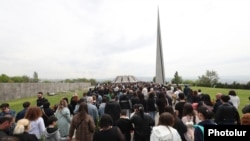 People walk to the Tsitsernakaberd memorial in Yerevan during an annual commemoration of the 1915 Armenian genocide, April 24, 2023.