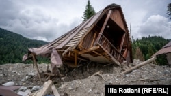 A cottage lies in ruin after a devastating landslide struck the resort town of Shovi on August 3, 2023.