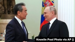  Șeful diplomației chineze, Wang Yi, la întâlnirea pe care a avut-o săptămâna trecută cu președintele rus Vladimir Putin.