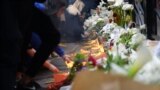 Citizens pay their respects in front of the Belgrade school "Vladislav Ribnikar" to the murdered students and security guard, May 4, 2023.