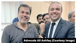 Pakistani journalist Imran Riaz Khan alongside his lawyer Ali Ashfaq