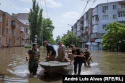 Every 15 minutes, a rescue boat brings people from the flooded parts of Kherson.