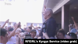 Opposition politician and former Prosecutor-General Azimbek Beknazarov is held aloft by supporters after being acquitted in the so-called Kempir-Abad trial on June 14.