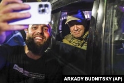 Prigozhin sits inside a military vehicle and poses for a selfie on a street in Rostov-on-Don, Russia, on June 24.