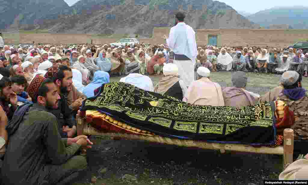 In Afghanistan, people gathered to attend funeral prayers for the victims of flash floods in Shahkoti village in the Lal Pur district of Nangarhar Province on April 15. Some 70 people died and 56 were injured in heavy rains and flooding nationwide, the National Disaster Management Authority said on April 18.