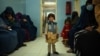 A child stands in a waiting room at the Tangi Saidan clinic run by the Swedish Committee for Afghanistan in the Day Mirdad district of the central Wardak Province.
