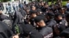 Armenia - Riot police confront Catholicos Garegin II and other top clergymen at Sardarapat memorial, May 28,. 2024.