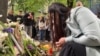 Mourners gather outside the school in Belgrade on May 4.