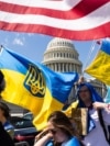 USA – Supporters of Ukraine wave US and Ukrainian flags outside the US Capitol after the House approved foreign aid packages to Ukraine, as well as Israel and Taiwan in the US Capitol in Washington, DC, USA, 20 April 2024
