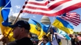 USA – Supporters of Ukraine wave US and Ukrainian flags outside the US Capitol after the House approved foreign aid packages to Ukraine, as well as Israel and Taiwan in the US Capitol in Washington, DC, USA, 20 April 2024