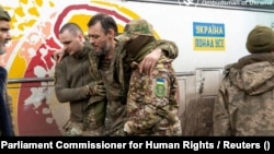 Ukrainian prisoners of wars after a prisoner swap with Russia at an unknown location in Ukraine (file photo)