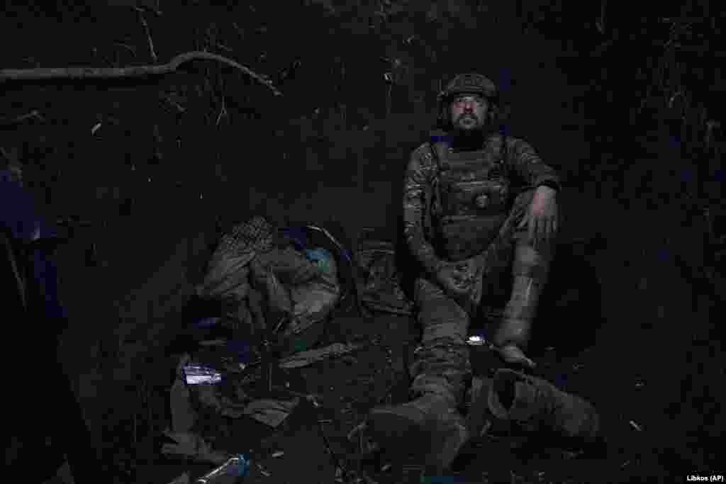 A Ukrainian soldier with the call sign &quot;Hammer&quot; looks up from his position in a trench on the front line in the Zaporizhzhya region. He&nbsp;lost his leg battling Russian troops and came back to the front with a prosthetic limb. In a June 30&nbsp;interview,&nbsp;Ukraine&#39;s military commander-in-chief, Valeriy Zaluzhniy, expressed frustration at the slow deliveries of weaponry promised by the West and its criticism of Kyiv&#39;s progress, &quot;Every day, every meter is given by blood.&quot; &nbsp;