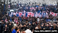 Georgians march to celebrate their country's European Union candidate status in Tbilisi on December 15. 