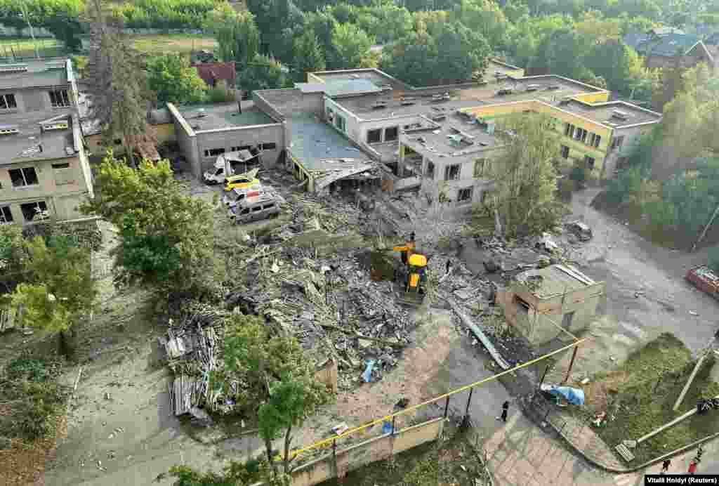 An aerial view shows the devastation following the attack on an educational institution and nearby apartment buildings. &nbsp;