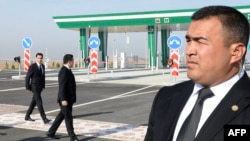 Turkmen President Serdar Berdymukhamedov (left) attended the opening ceremony for the new highway section on April 17. 