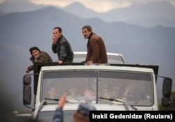 Refugees from the Nagorno-Karabakh region arrive by truck in the border village of Kornidzor, Armenia, in September.