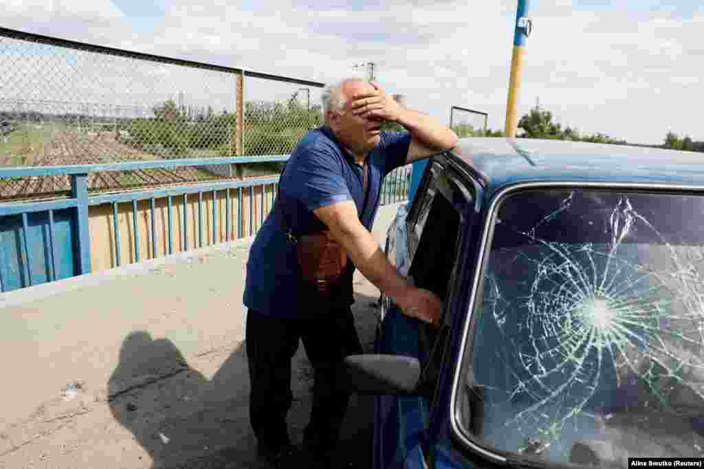  A man reacts next to a damaged car at the site of a Russian missile strike in Pokrovsk, Donetsk region, Ukraine. &nbsp; 